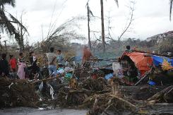 Woman finds pet dog lost in Philippines typhoon a year ago